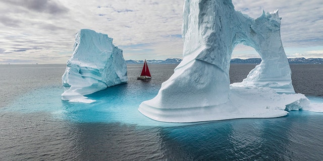 Five weeks into the journey of the National Geographic expedition ship Polar Sun, photographer Renan Ozturk found himself exploring a bay off the coast of Greenland. The boat played peekaboo with pale blue icebergs as Ozturk readied his camera drone and held his breath.