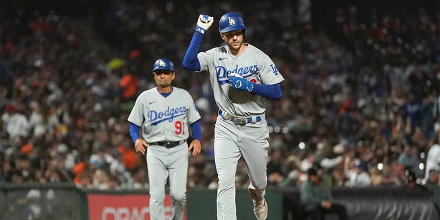 Los Angeles Dodgers' Trea Turner pumps his fist after hitting a home run against the San Francisco Giants during the seventh inning in San Francisco, Aug. 1, 2022.
