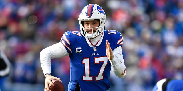 Buffalo Bills quarterback Josh Allen (17) looks to pass during the first half of an NFL wild-card playoff football game against the Miami Dolphins, Sunday, Jan. 15, 2023, in Orchard Park, N.Y.