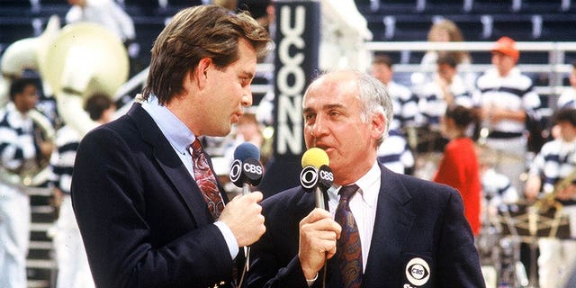 CBS college basketball broadcast commentators Jim Nantz (left) and Billy Packer on the court for pregame analysis in Storrs, Conn., in 1991. 