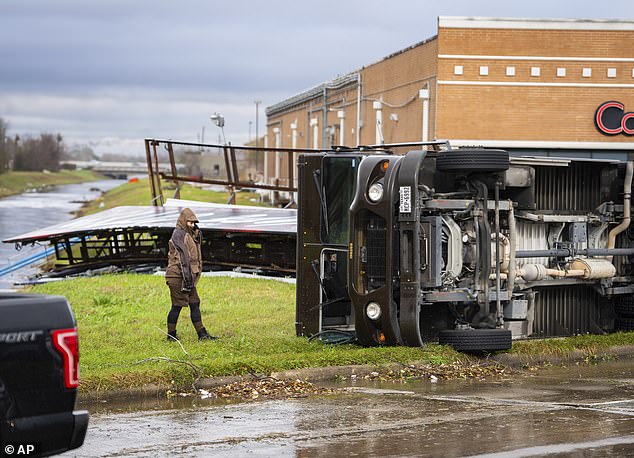 A UPS truck is overturned where a tornado was reported to pass