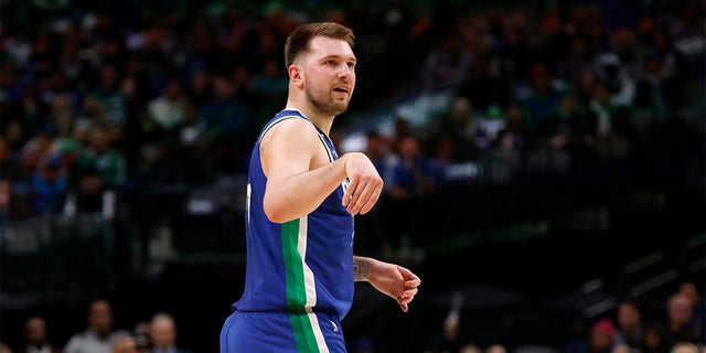 Luka Doncic, #77 of the Dallas Mavericks, gestures after scoring a three-point basket against the Detroit Pistons in the first half at American Airlines Center on Jan. 30, 2023 in Dallas.