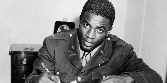 Jackie Robinson, in military uniform, became the first African American to sign with a White professional baseball team. He signed a contract with the minor league club in Montreal, a farm team for the Brooklyn Dodgers.