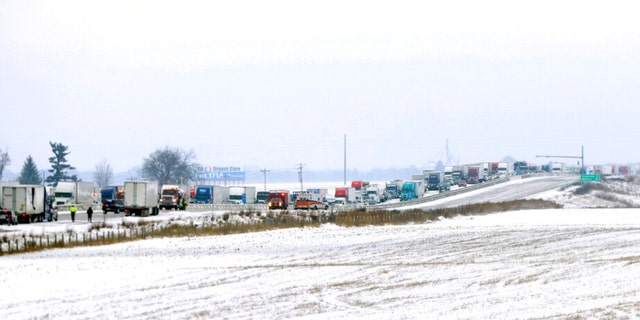Emergency crews respond to a multi-vehicle accident in both the north and south lanes of Interstate 39/90 on Friday, Jan. 27, 2023, in Turtle, Wisconsin.