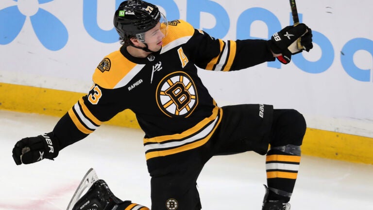 The Bruins Charlie McAvoy celebrates after he beat Sharks goalie James Reimer (not pictured) for a second period goal. The Boston Bruins hosted the San Jose Sharks in a regular season NHL hockey game at the TD Garden.