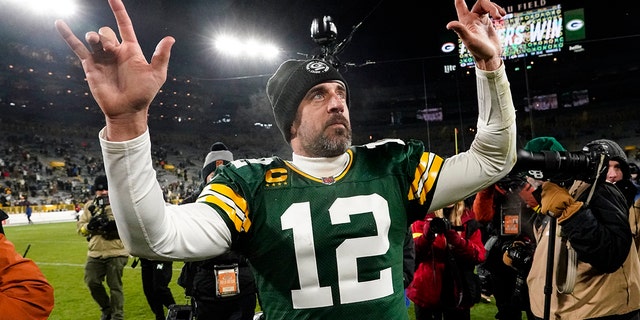 Green Bay Packers quarterback Aaron Rodgers, #12, waves to fans as he leaves the field following an NFL football game against the Los Angeles Rams in Green Bay, Wisconsin, Monday, Dec. 19, 2022. 