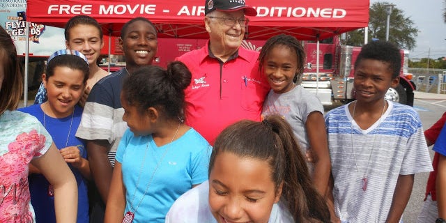 Tuskegee Airman and retired Lt. Col. George Hardy with children at Robert L. Taylor Community Complex in Sarasota, Florida, in 2013. 
