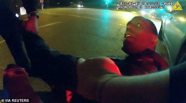 The violent incident began with officers dragging Nichols from the driver's seat of his car as he yells out, 'D**n, I didn't do anything ... I am just trying to go home'