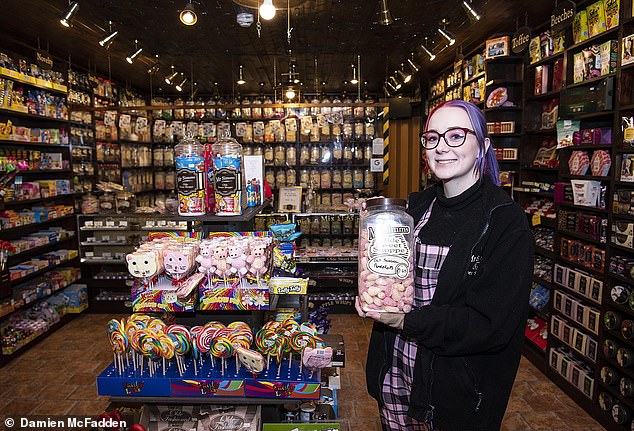 Job threat: Charlotte Rowe works at Mr Simms Olde Sweet Shoppe, in Birmingham's Great Western Arcade where trade is down 30 to 35 per cent on pre-lockdown levels