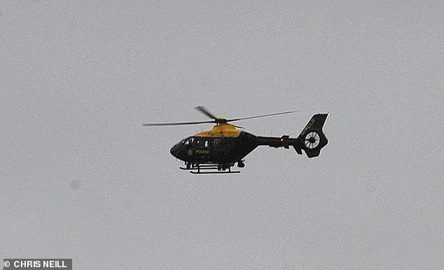 Pictured: A police helicopter over St Michael's on Wyre, Lancashire, as police continue their search