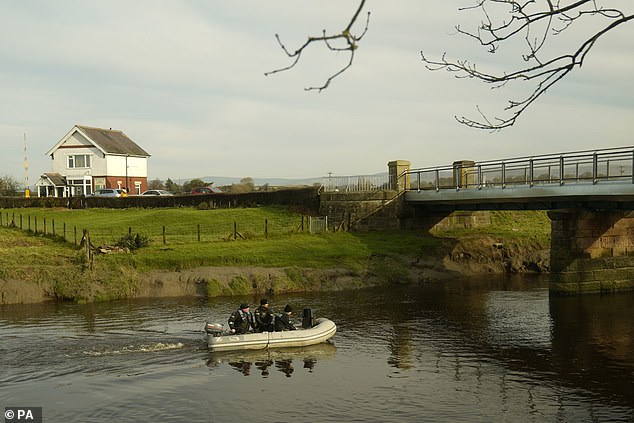 Police search teams were pictured in boats on the River looking for the missing 45-year-old