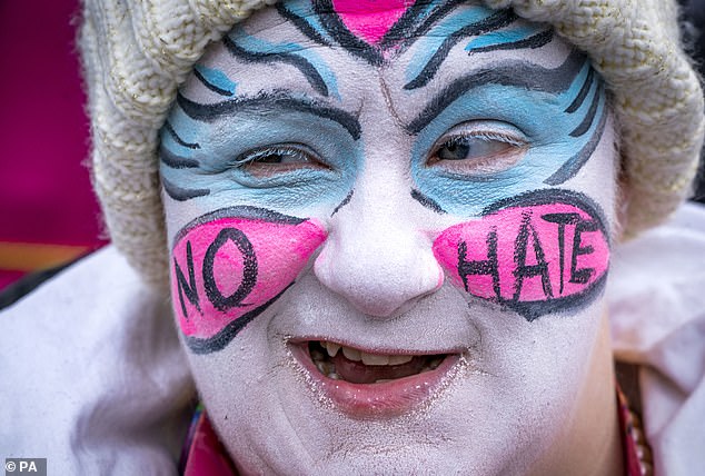 One attendee painted their face in the colours of the trans flag, with the words 'no hate' on their cheeks