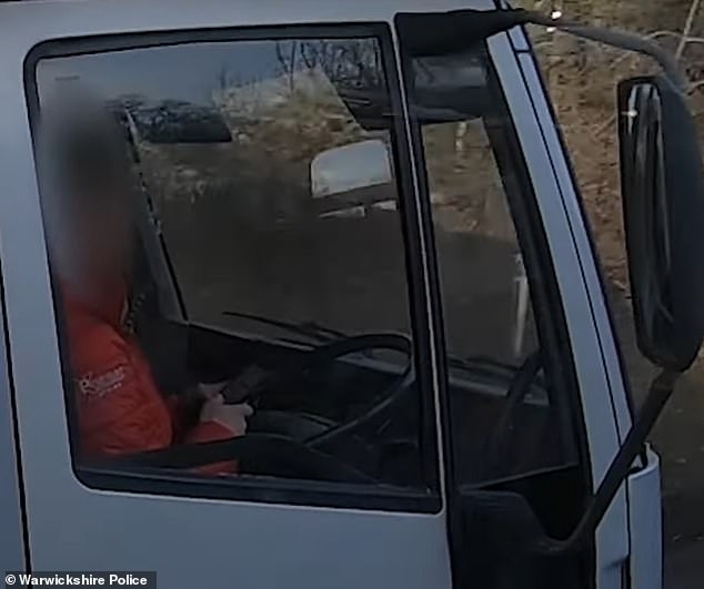 More than 100 acts of roadside lawlessness were caught on camera as police carried out a truck operation that saw several drivers using their mobile phones at the wheel (pictured)