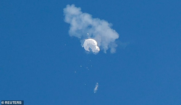 The suspected Chinese spy balloon drifts to the ocean after being shot down off the coast in Surfside Beach, South Carolina, U.S. February 4, 2023