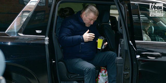 Alec Baldwin gets out of a car outside his apartment on Feb. 1.