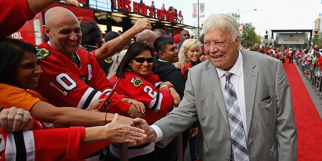 Former player and member of the Hockey Hall of Fame Bobby Hull of the Chicago Blackhawks greets fans during a "red carpet" event before the season opening game against the Pittsburgh Penguins at the United Center on October 5, 2017 in Chicago, Illinois. 