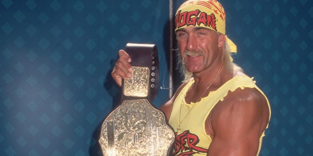 Hulk Hogan displaying his championship belt. 