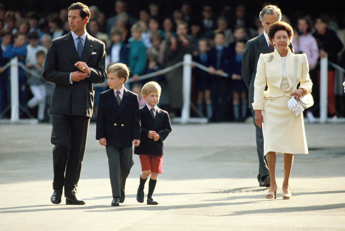Prince Harry, who said he and  Princess Margaret should've been friends in 'Spare, walks with Princess Margaret, King Charles III, and Prince William.