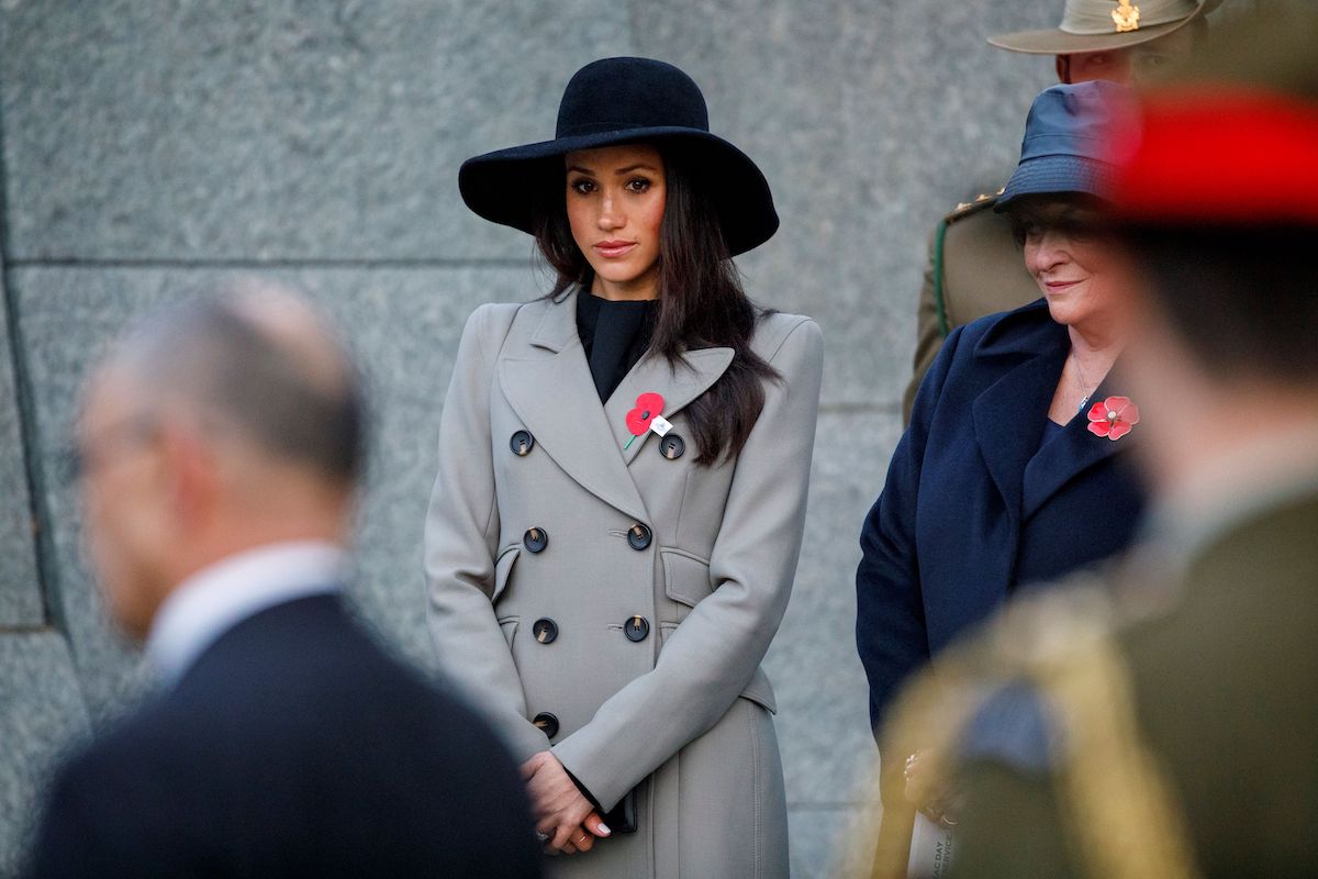 Meghan Markle, who was accused of bullying after which findings from a report were never released, looks on