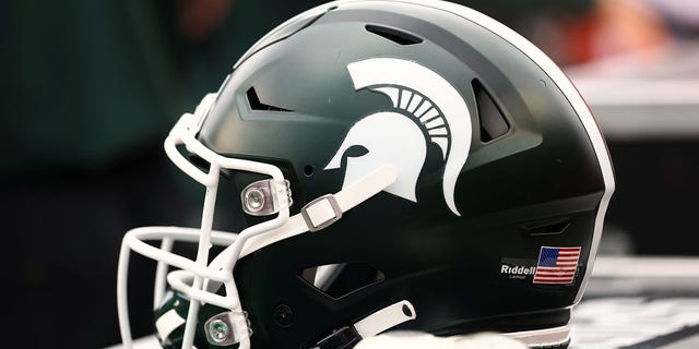 A Michigan State Spartans helmet sits on the sideline during a game against the Rutgers Scarlet Knights at SHI Stadium Oct. 9, 2021, in Piscataway, N.J.