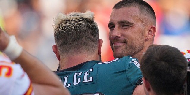 Philadelphia Eagles center Jason Kelce (62) and Kansas City Chiefs tight end Travis Kelce (87) embrace during the game between the Philadelphia Eagles and the Kansas City Chiefs on October 3, 2021, at Lincoln Financial Field in Philadelphia, PA.