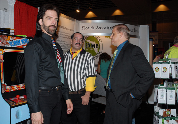 Another angle showing Mitchell, Rogers, and Ritch Workman in front of the seemingly modified <em>Donkey Kong</em> cabinet.