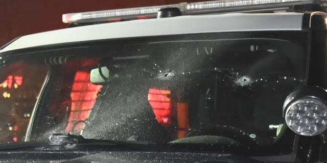 San Jose PD patrol car with bullet holes. 