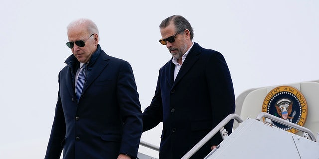 President Joe Biden and his son, Hunter Biden, step off Air Force One, Saturday, Feb. 4, 2023, at Hancock Field Air National Guard Base in Syracuse, N.Y. 
