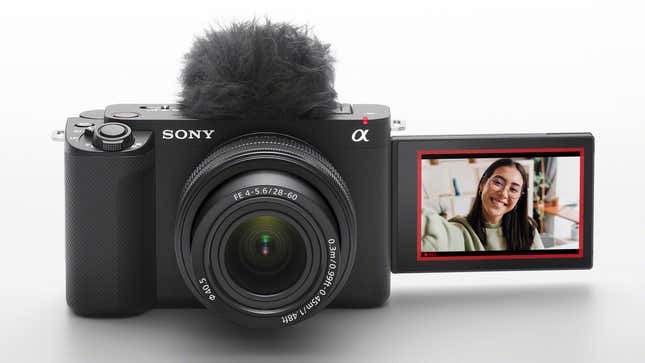 The Sony ZV-E1on a white background with the LCD screen flipped facing forward with a person on-screen.