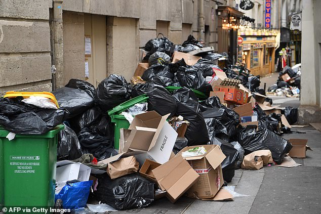 Rubbish has piled up on the street in Paris' 5th district, as rubbish collectors strike against pension reforms,  leaving many streets in the capital piled with waste