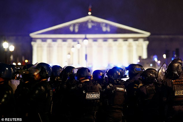Gendarmerie members stand guard during a demonstration on Place de la Concorde to protest the use by French government of the article 49.3 on March 17, 2023