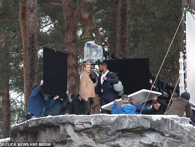 Set: The crew were seen standing around Cameron and Jamie perfecting the lighting as they shot one moment