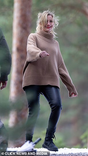 Comfortable: She swapped her heeled boots for lace-up flats in between takes