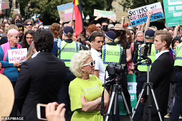 Ms Keen with her security at the Tasmanian Parliament House lawns in Hobart on Tuesday