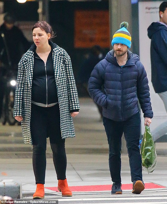 Bumping along nicely: The news comes just a day after the pair enjoyed a loved-up stroll in New York on Friday , with Erin, 38, seen with a significantly rounded stomach