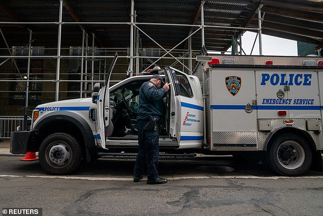 A member of the NYPD Emergency Services unit arrives at Manhattan District Attorney Alvin Bragg's office, following reports that an envelope containing white powder was delivered