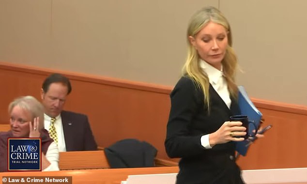 Paltrow takes her seat at the defense table with her signature blue folder