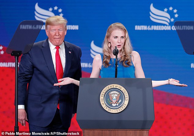 Natalie Harp, pictured with Donald Trump in 2019 at the Faith & Freedom Coalition Conference in Washington, credits a law signed by the former president for helping her beat bone cancer