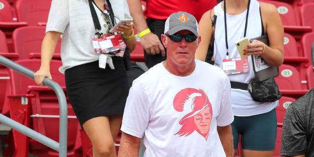 Pro Football Hall of Famer Brett Favre shows his support by wearing the Tom Brady version of the Bucco Bruce vintage Bucs T-shirt before a game between the Carolina Panthers and the Tampa Bay Buccaneers Sept. 20, 2020, at Raymond James Stadium in Tampa, Fla.
