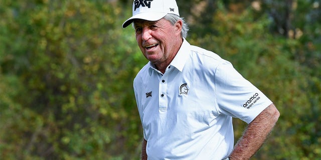 Gary Player laughs as he arrives at the tenth hole during the first round of the 2022 PNC Championship at The Ritz-Carlton Golf Club in Orlando, Florida.