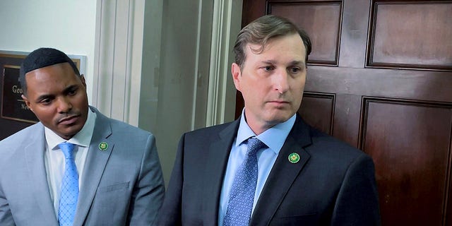 Reps. Ritchie Torres and Daniel Goldman speak to reporters outside of Rep. George Santos' office on Jan 10, 2023.