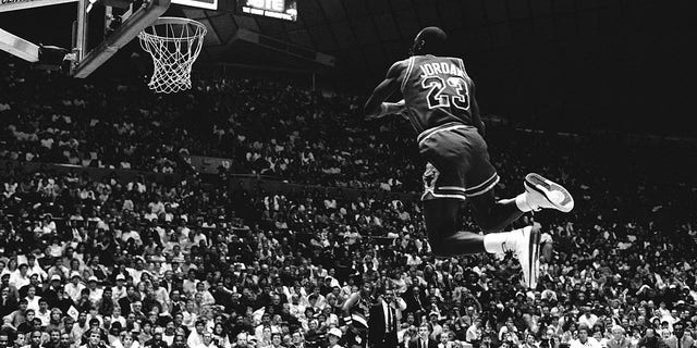 Michael Jordan (#23) of the Chicago Bulls attempts a dunk during the 1987 Slam Dunk Contest on Feb. 7, 1987, at Seattle Center Coliseum in Seattle, Washington. 