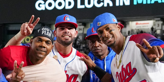 Members of Team Cuba celebrate after winning the WBC quarterfinal game against Team Australia on March 15, 2023, in Tokyo, Japan.