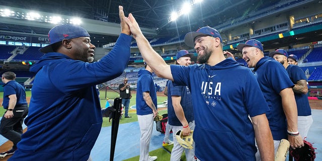 Hitting coach Ken Griffey Jr., #24, celebrates with Kyle Schwarber, #12 of Team USA, after batting practice during the Team USA workout prior to the 2023 World Baseball Classic Quarterfinal game between Team Puerto Rico and Team Mexico at loanDepot Park on Friday, March 17, 2023, in Miami, Florida.