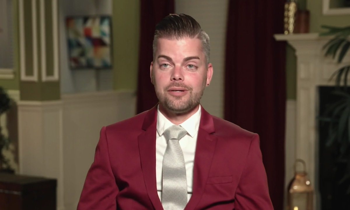 Tim Malcolm wearing a suit on '90 Day Fiancé' for TLC.