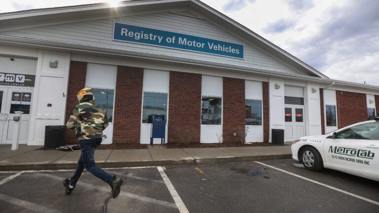 A customer walks into the Registry of Motor Vehicles office in Brockton.