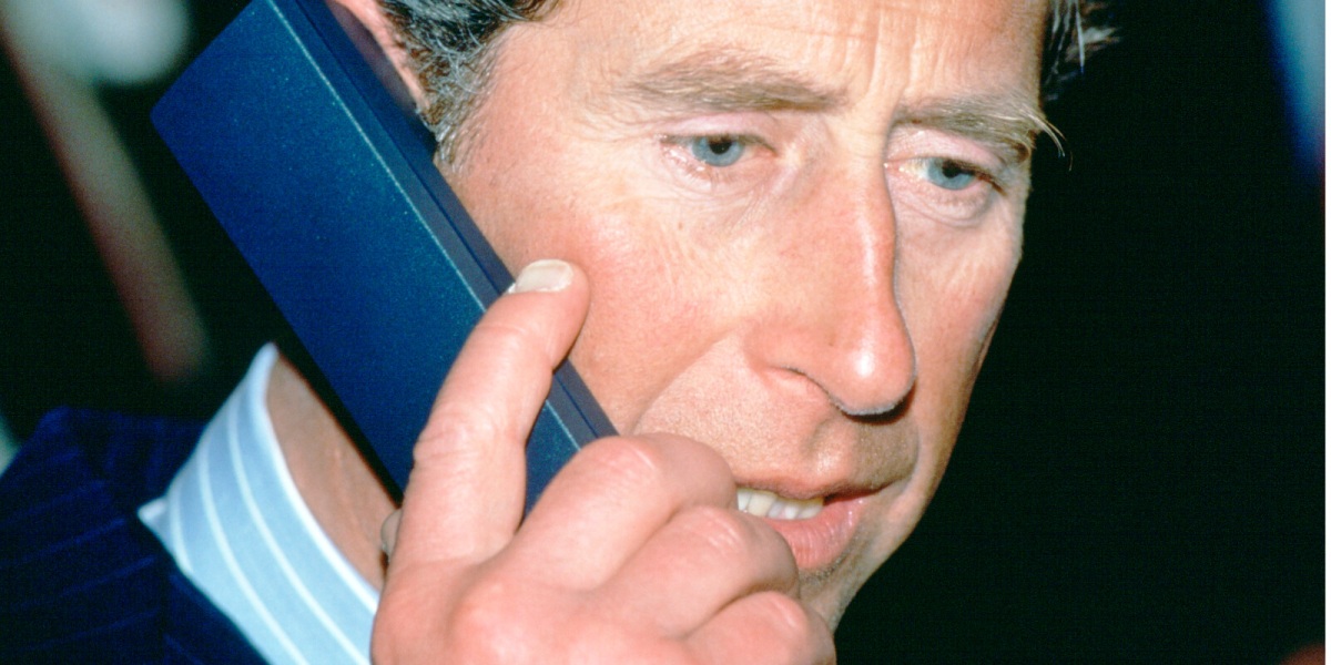 King Charles pictured in 1994 using a telephone.
