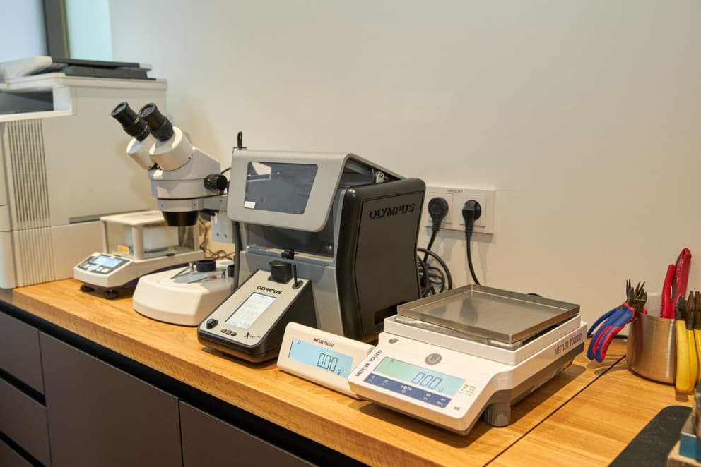Degussa Goldhandel uses these devices to determine the value of gold jewelry.  From left: Magnetic balance, high-performance microscope, X-ray fluorescence analysis and precision balance