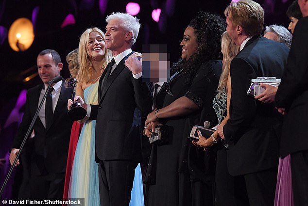 Schofield on stage with the young man (pictured middle) at the 2018 National Television Awards