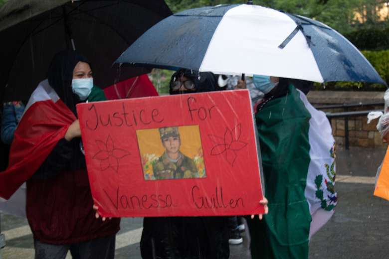 Protesters carry a poster in memory of murdered US soldier Vanessa Guillén